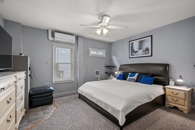 bedroom with ceiling fan, an AC wall unit, baseboards, and light colored carpet