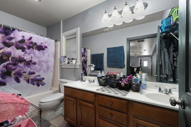 full bath with tile patterned floors, a sink, toilet, and double vanity