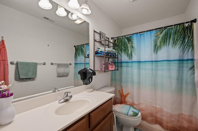 full bathroom with toilet, vanity, and visible vents