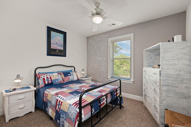 bedroom with baseboards, carpet flooring, visible vents, and a ceiling fan