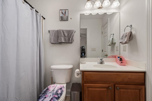 bathroom featuring toilet and vanity