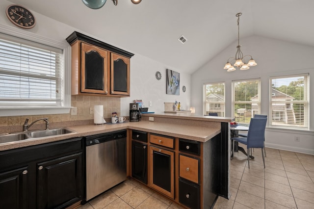 kitchen featuring dishwasher, a sink, a wealth of natural light, and a chandelier