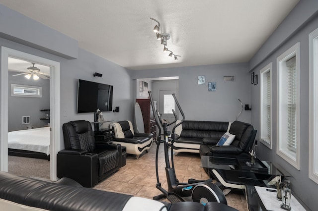 living area with a textured ceiling