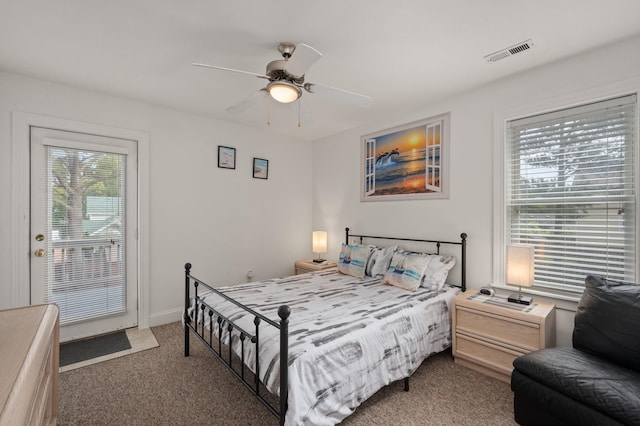 bedroom featuring ceiling fan, dark carpet, visible vents, and access to exterior