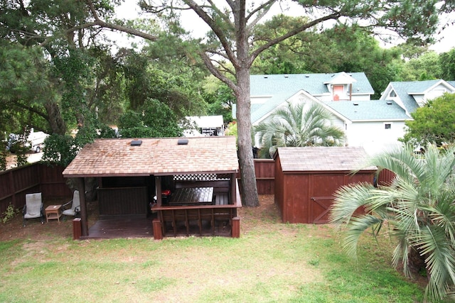 view of yard with fence and outdoor dry bar