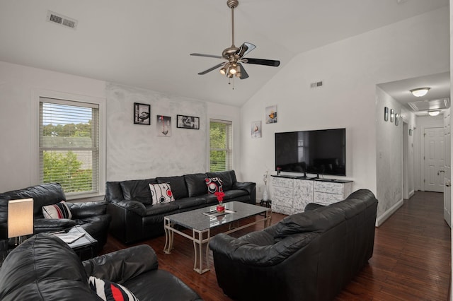 living area featuring visible vents, vaulted ceiling, and dark wood-type flooring