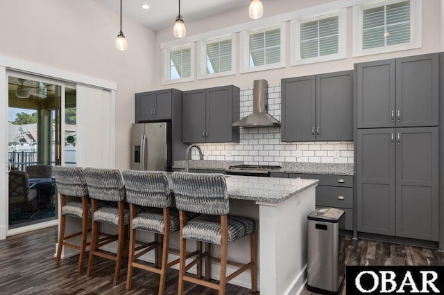 1303 W First St Lot 63, Kill Devil Hills, NC 27948 - kitchen with stainless steel appliances, wall chimney exhaust hood, a sink, decorative backsplash, and plenty of natural light