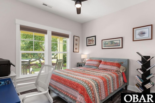 1303 W First St Lot 63, Kill Devil Hills, NC 27948 - bedroom featuring wood finished floors, ceiling fan, and baseboards