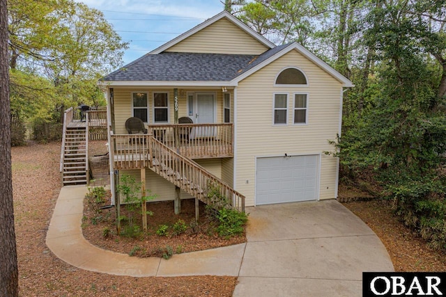 5209 Winsor Pl Lot 41, Kitty Hawk, NC 27949 - view of front facade featuring stairs, roof with shingles, covered porch, an attached garage, and driveway