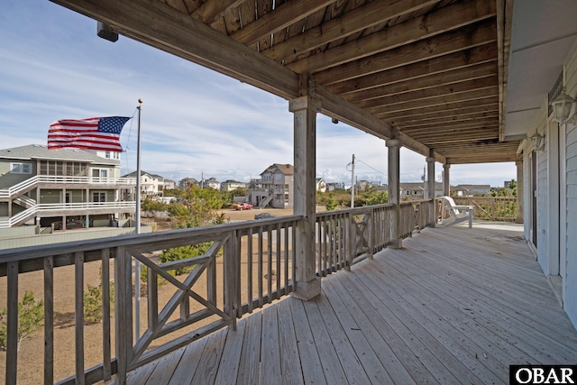 wooden terrace with a residential view