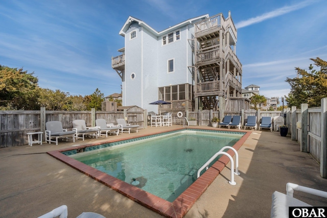 view of pool with a patio, a fenced in pool, and a fenced backyard