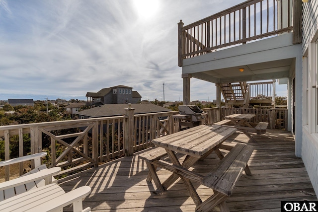 wooden terrace featuring area for grilling