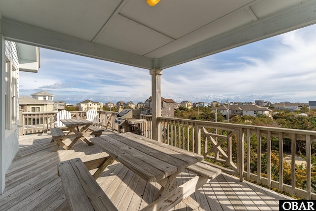 wooden deck featuring a residential view