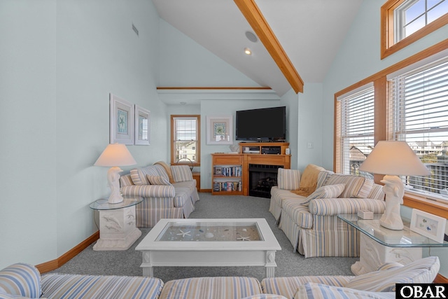 living room featuring carpet, visible vents, baseboards, high vaulted ceiling, and a fireplace