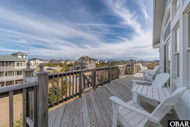 wooden terrace with a residential view