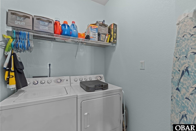 clothes washing area with washer and dryer and laundry area