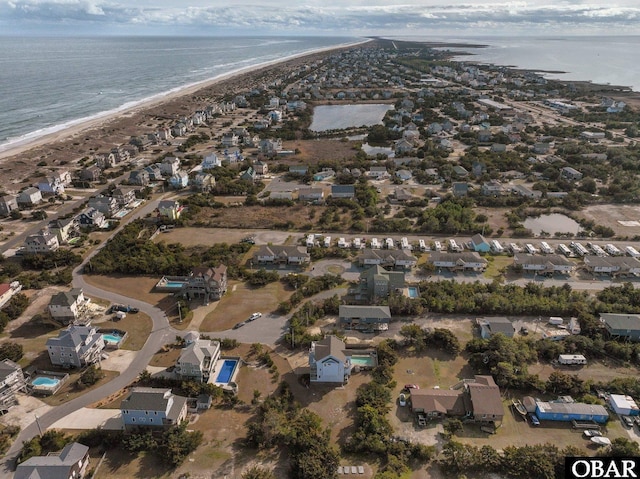 aerial view with a water view and a view of the beach