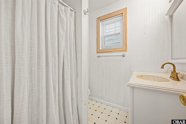 614-B Sea Oats Ct Lot # 6, Corolla, NC 27927 - full bath with vanity, tile patterned floors, and a shower with shower curtain
