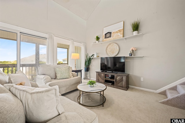 614-B Sea Oats Ct Lot # 6, Corolla, NC 27927 - carpeted living room featuring plenty of natural light and high vaulted ceiling