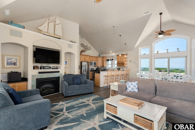 56432 NC-12 Hwy Lot 1, Hatteras, NC 27943 - living area with ceiling fan, dark wood-style flooring, high vaulted ceiling, and a tiled fireplace
