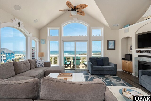 56432 NC-12 Hwy Lot 1, Hatteras, NC 27943 - living room with ceiling fan, plenty of natural light, dark wood finished floors, arched walkways, and high vaulted ceiling