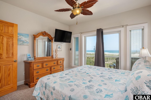 56432 NC-12 Hwy Lot 1, Hatteras, NC 27943 - bedroom featuring access to exterior, light carpet, baseboards, and a ceiling fan