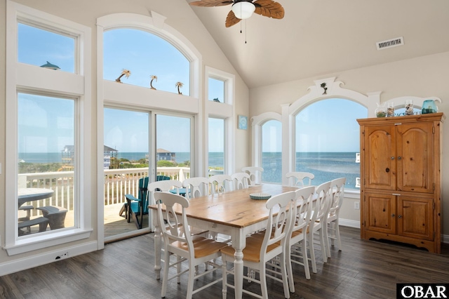 56432 NC-12 Hwy Lot 1, Hatteras, NC 27943 - dining space with a ceiling fan, dark wood-style floors, high vaulted ceiling, and a water view