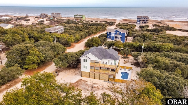 bird's eye view with a water view and a view of the beach