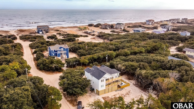 aerial view featuring a water view and a view of the beach