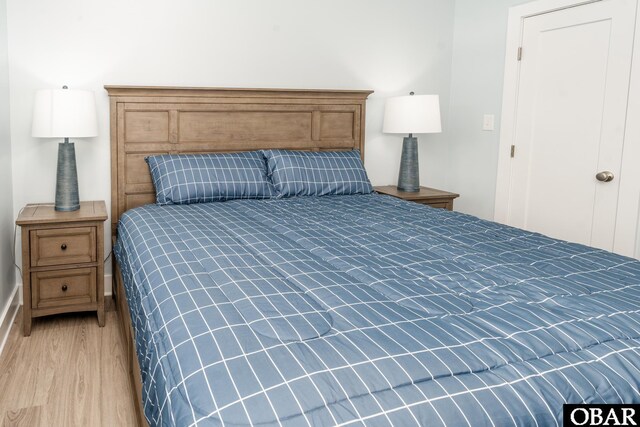 bedroom featuring light wood-style flooring