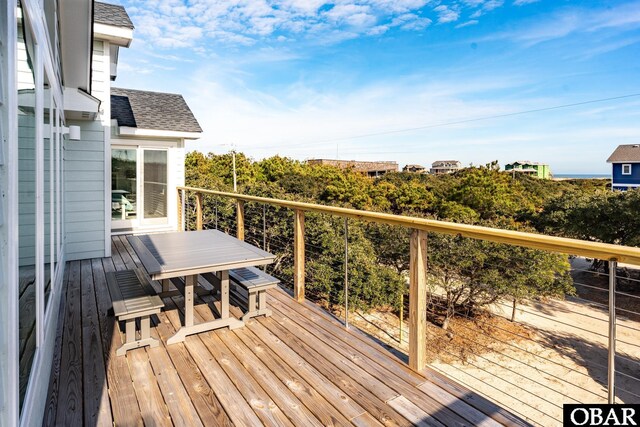 wooden deck featuring outdoor dining area