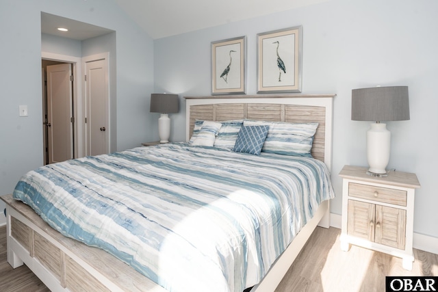 bedroom featuring light wood-style flooring