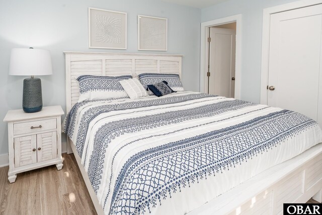 bedroom featuring wood finished floors