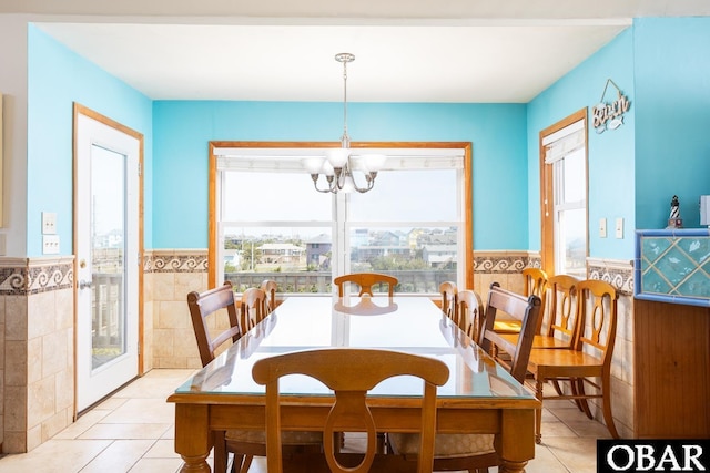 23212 Sea Oats Dr Lot 18, Rodanthe, NC 27968 - dining area featuring light tile patterned floors, a wainscoted wall, and a wealth of natural light