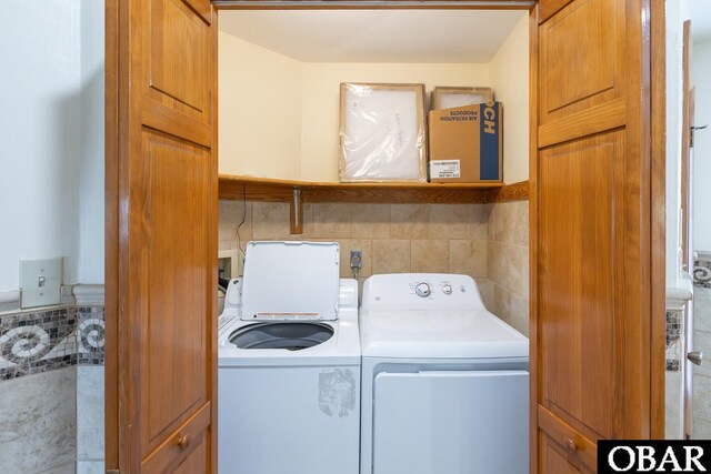 23212 Sea Oats Dr Lot 18, Rodanthe, NC 27968 - clothes washing area with washing machine and clothes dryer and laundry area