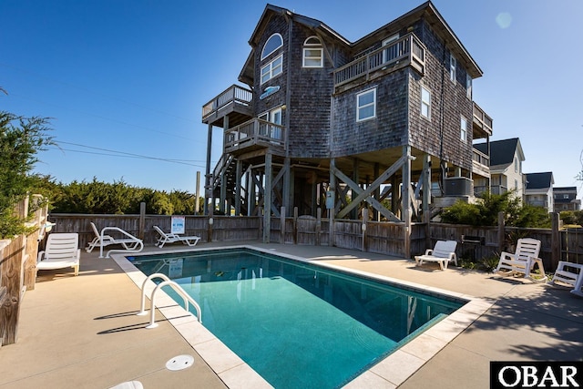 23212 Sea Oats Dr Lot 18, Rodanthe, NC 27968 - view of swimming pool with stairway, a fenced in pool, a fenced backyard, and a patio area