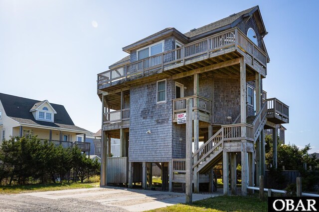 23212 Sea Oats Dr Lot 18, Rodanthe, NC 27968 - view of front facade featuring stairway and a balcony