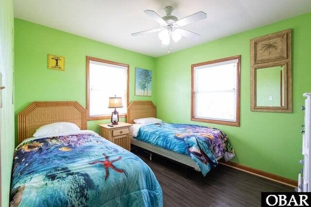 23212 Sea Oats Dr Lot 18, Rodanthe, NC 27968 - bedroom with baseboards, ceiling fan, multiple windows, and wood finished floors