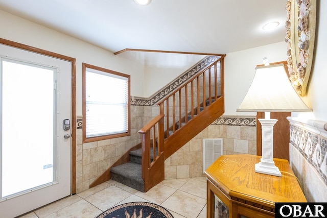 23212 Sea Oats Dr Lot 18, Rodanthe, NC 27968 - tiled entryway featuring visible vents, plenty of natural light, stairway, and tile walls