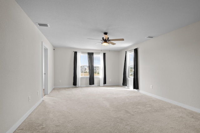 104 Garland St Lot 3, Moyock, NC 27958 - unfurnished room featuring light carpet, visible vents, baseboards, and ceiling fan