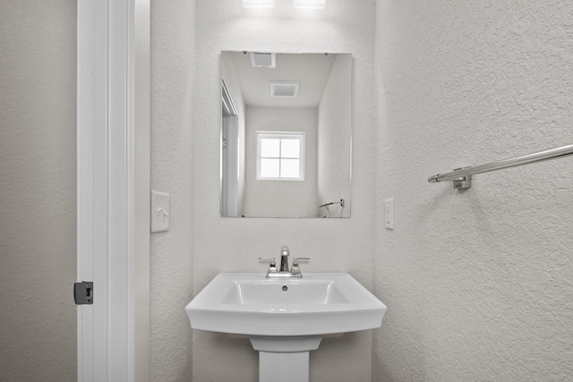 104 Garland St Lot 3, Moyock, NC 27958 - bathroom with a textured wall, visible vents, and a sink