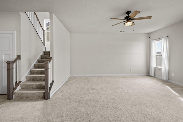 104 Garland St Lot 3, Moyock, NC 27958 - unfurnished living room with carpet floors, ceiling fan, baseboards, and stairs