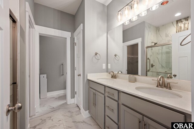 1304 Harpoon Dr Lot # 70, Kill Devil Hills, NC 27948 - full bath featuring marble look tiles, a marble finish shower, double vanity, baseboards, and a spacious closet