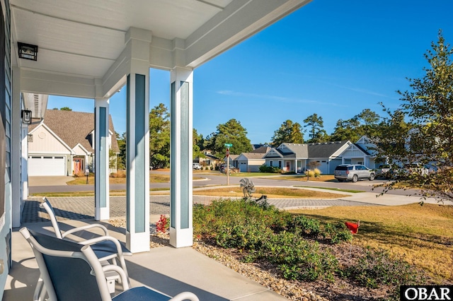 1304 Harpoon Dr Lot # 70, Kill Devil Hills, NC 27948 - covered porch featuring a residential view