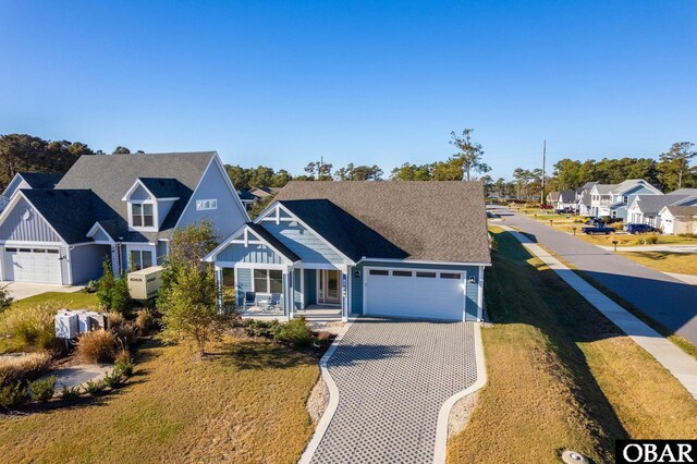 1304 Harpoon Dr Lot # 70, Kill Devil Hills, NC 27948 - view of front facade with a residential view, an attached garage, driveway, and a front yard