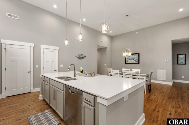 1304 Harpoon Dr Lot # 70, Kill Devil Hills, NC 27948 - kitchen with dishwasher, a sink, baseboards, a high ceiling, and light wood-type flooring
