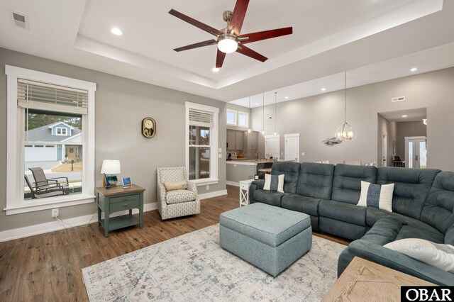 1304 Harpoon Dr Lot # 70, Kill Devil Hills, NC 27948 - living area with a ceiling fan, a raised ceiling, plenty of natural light, wood finished floors, and recessed lighting
