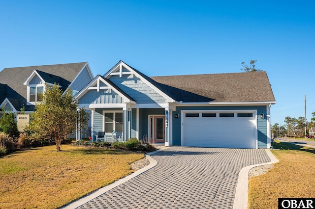 1304 Harpoon Dr Lot # 70, Kill Devil Hills, NC 27948 - view of front of property featuring a garage, a front yard, driveway, and board and batten siding