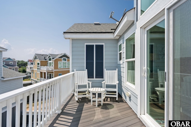 wooden deck with a residential view