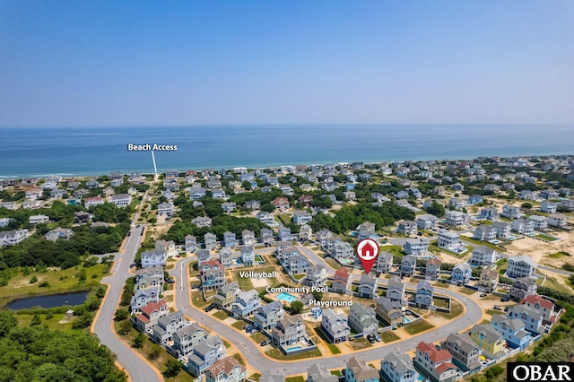 birds eye view of property with a water view and a residential view